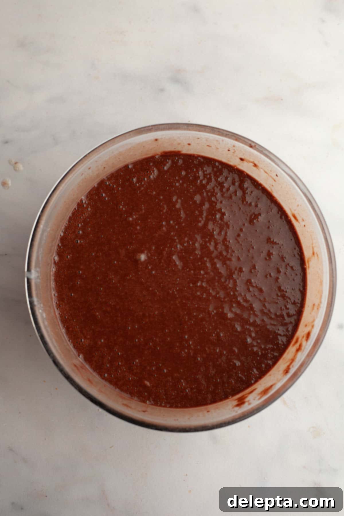 Decadent Chocolate Strawberry Dream Cake 6 Chocolate cake batter in a glass bowl.