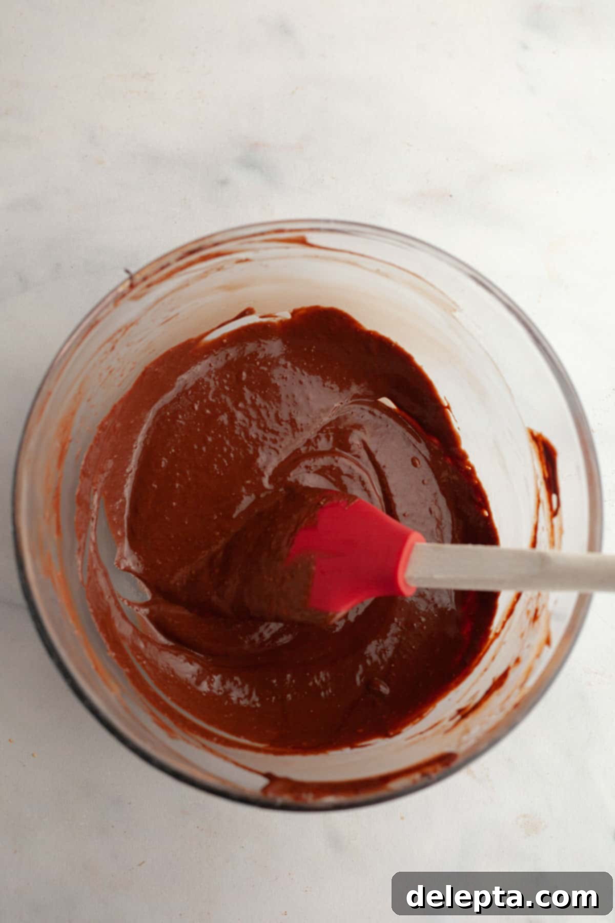 Decadent Chocolate Strawberry Dream Cake 9 Chocolate strawberry ganache in a bowl.