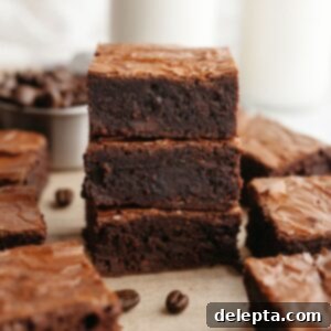 Easy One-Bowl Fudgy Espresso Brownies 12 A stack of three fudgy espresso brownies.