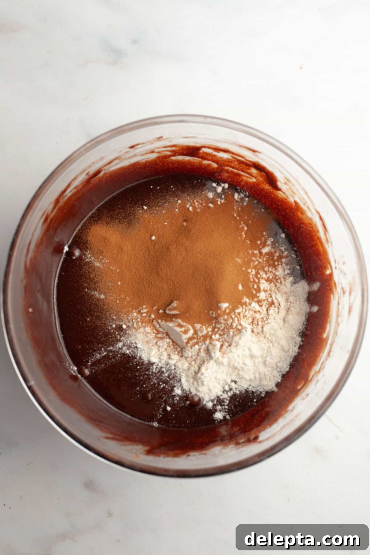 Easy One-Bowl Fudgy Espresso Brownies 7 A bowl with brownie batter, flour, and espresso powder in it.