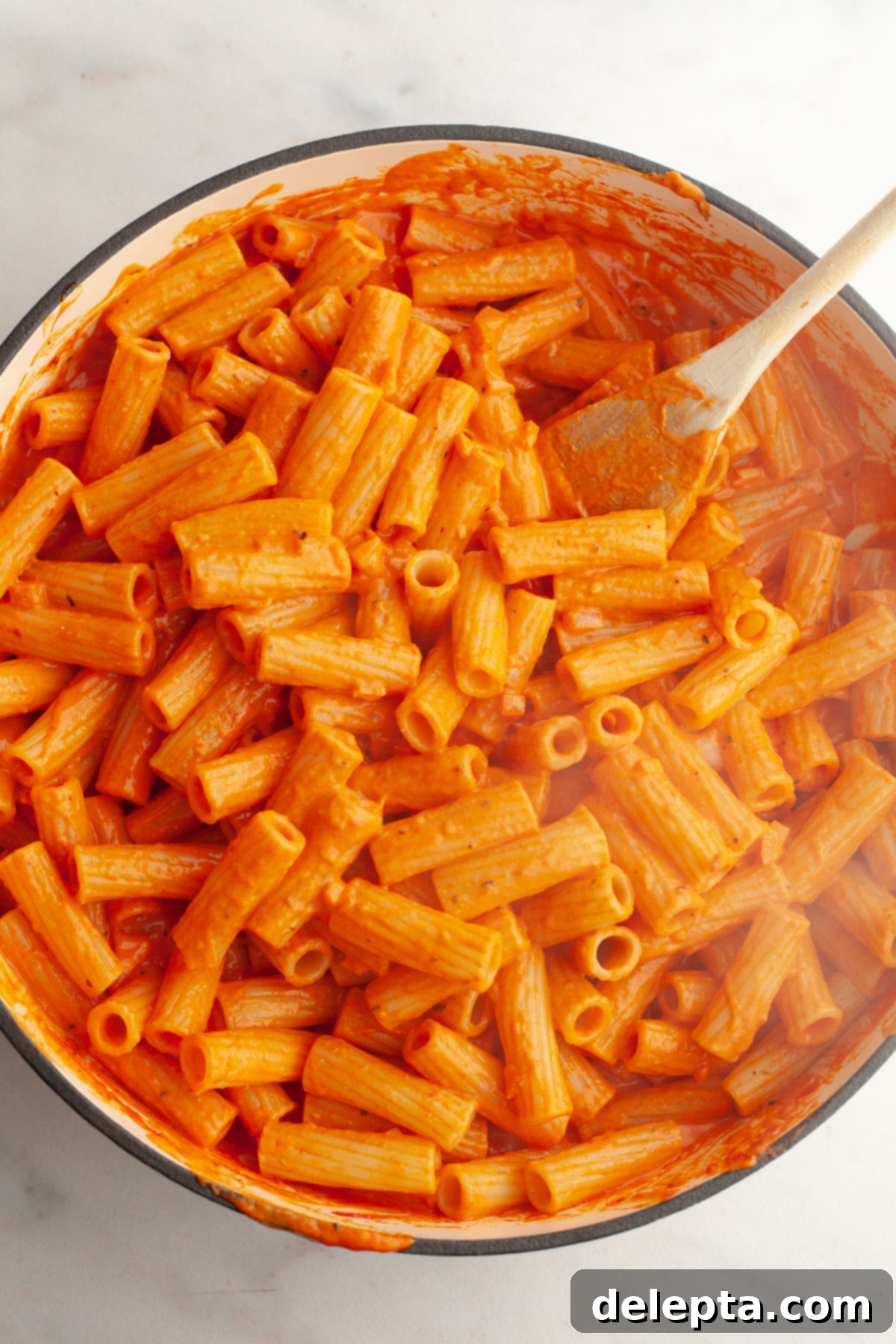 Easy Baked Pasta with Virgin Vodka Sauce 8 Cooked pasta mixed thoroughly with creamy vodka sauce in a large saucepan.