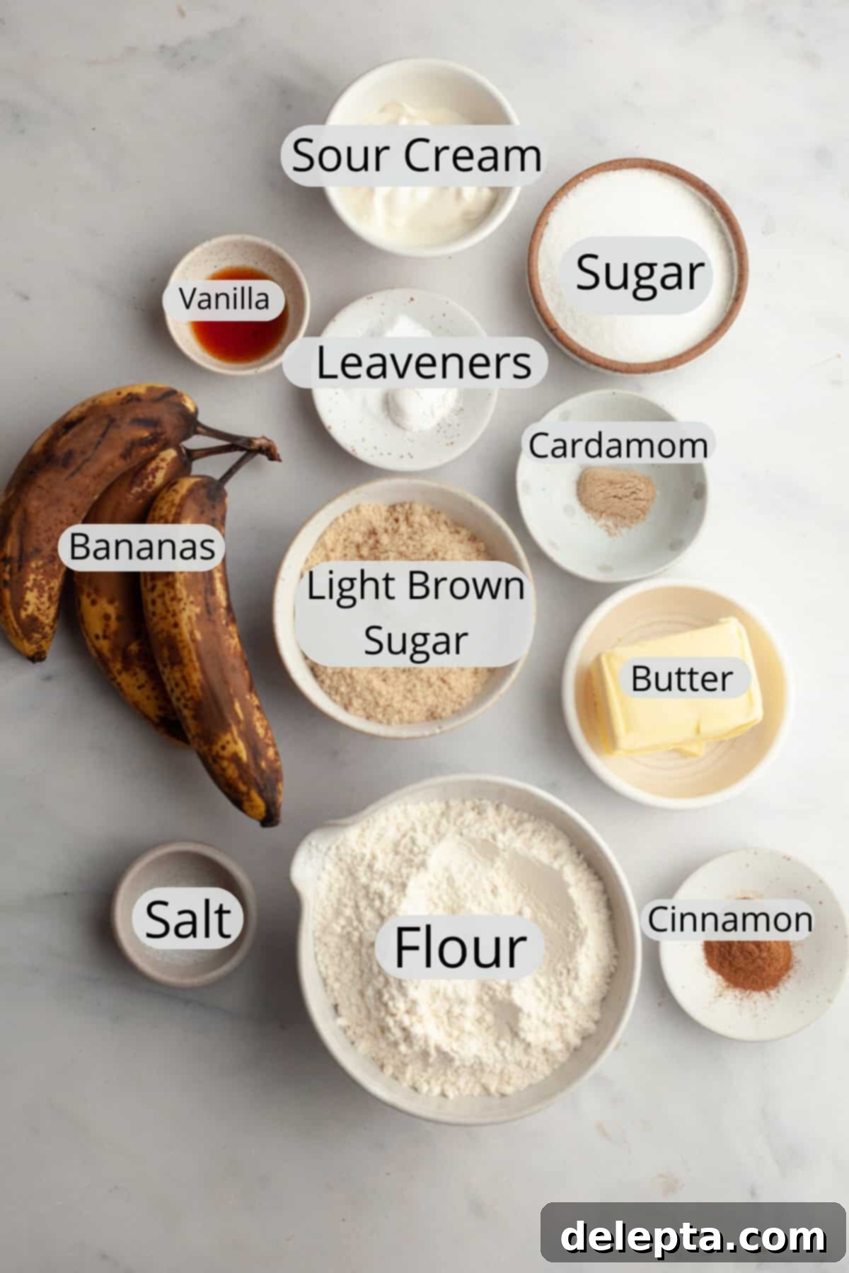 Cinnamon Crumble Banana Muffins 3 All the essential ingredients for banana coffee cake muffins, meticulously weighed out and organized in small bowls, ready for baking.
