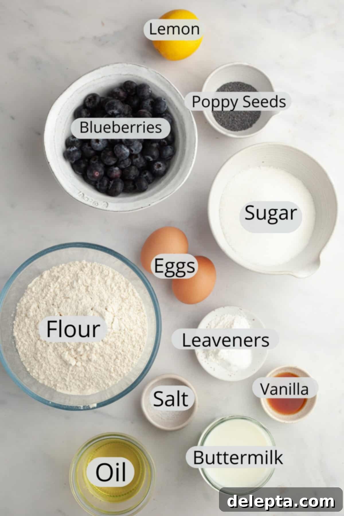 Sunny Lemon Blueberry Poppy Seed Muffins One Bowl Delight 3 All the essential ingredients for making blueberry lemon poppy seed muffins, meticulously weighed out and arranged in small bowls.