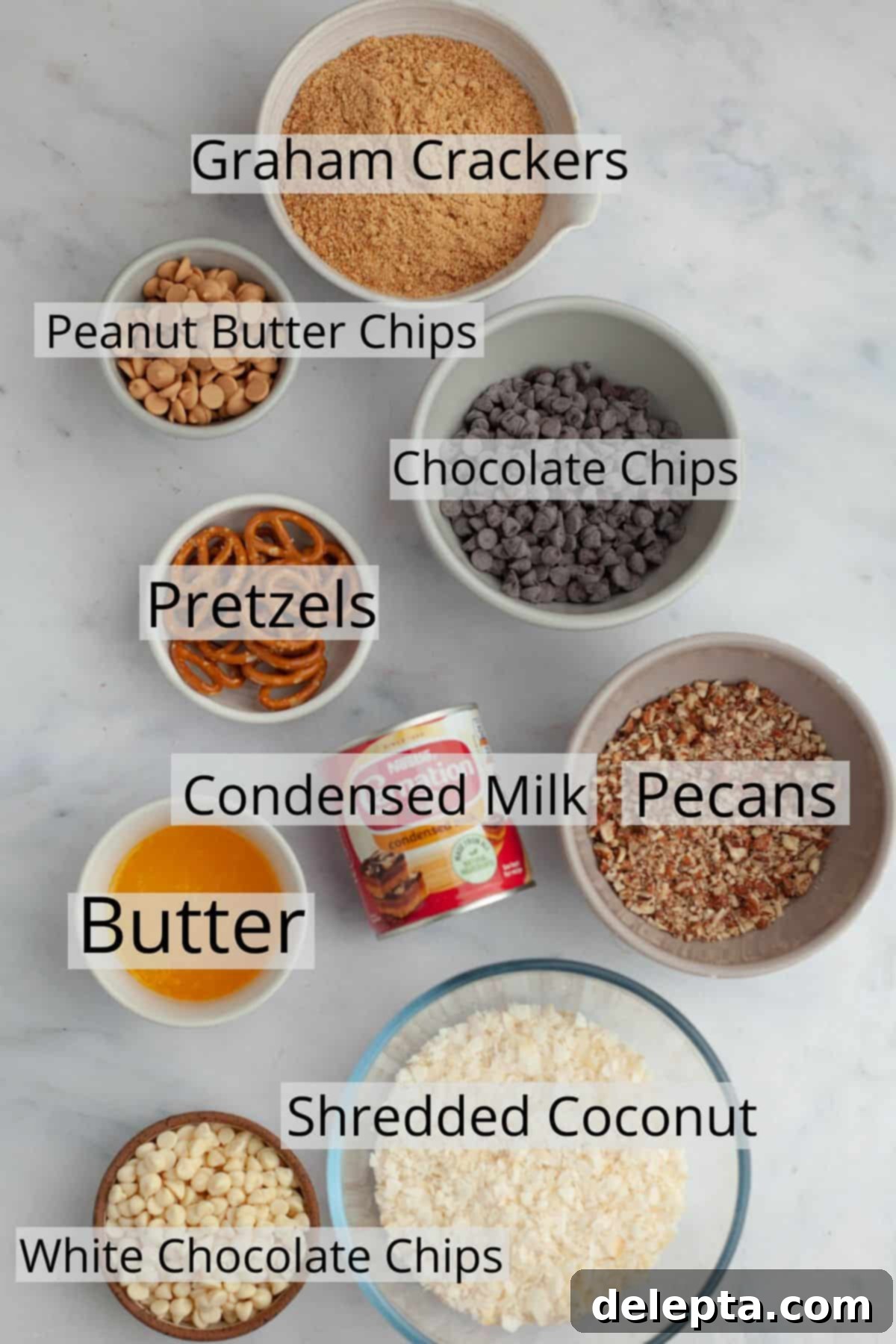 Sweet and Salty Seven Layer Pretzel Bars 3 All the ingredients needed to make hello dolly bars weighed out into small bowls.