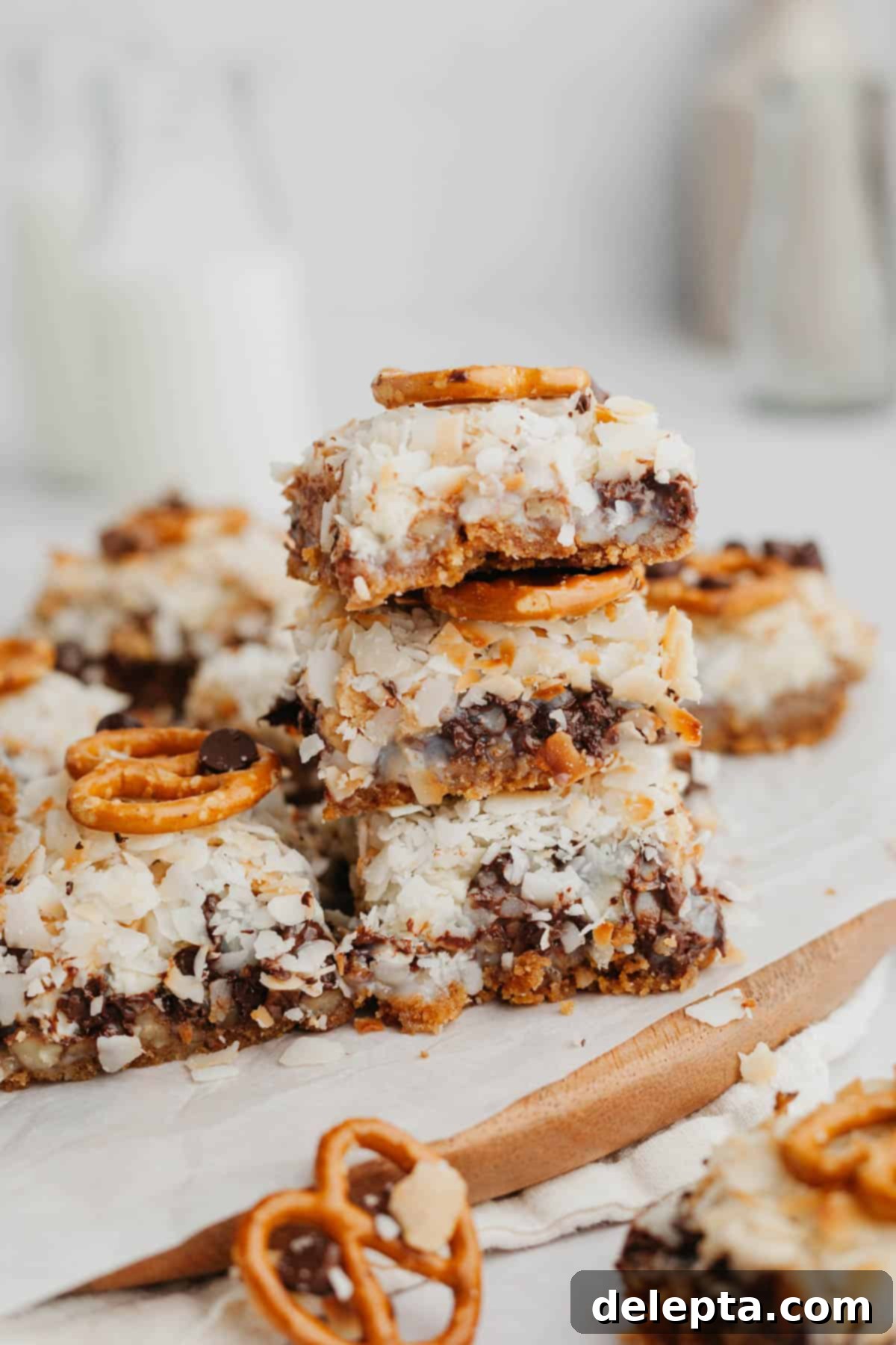 Sweet and Salty Seven Layer Pretzel Bars 6 A stack of 3 magic cookie layer bars.