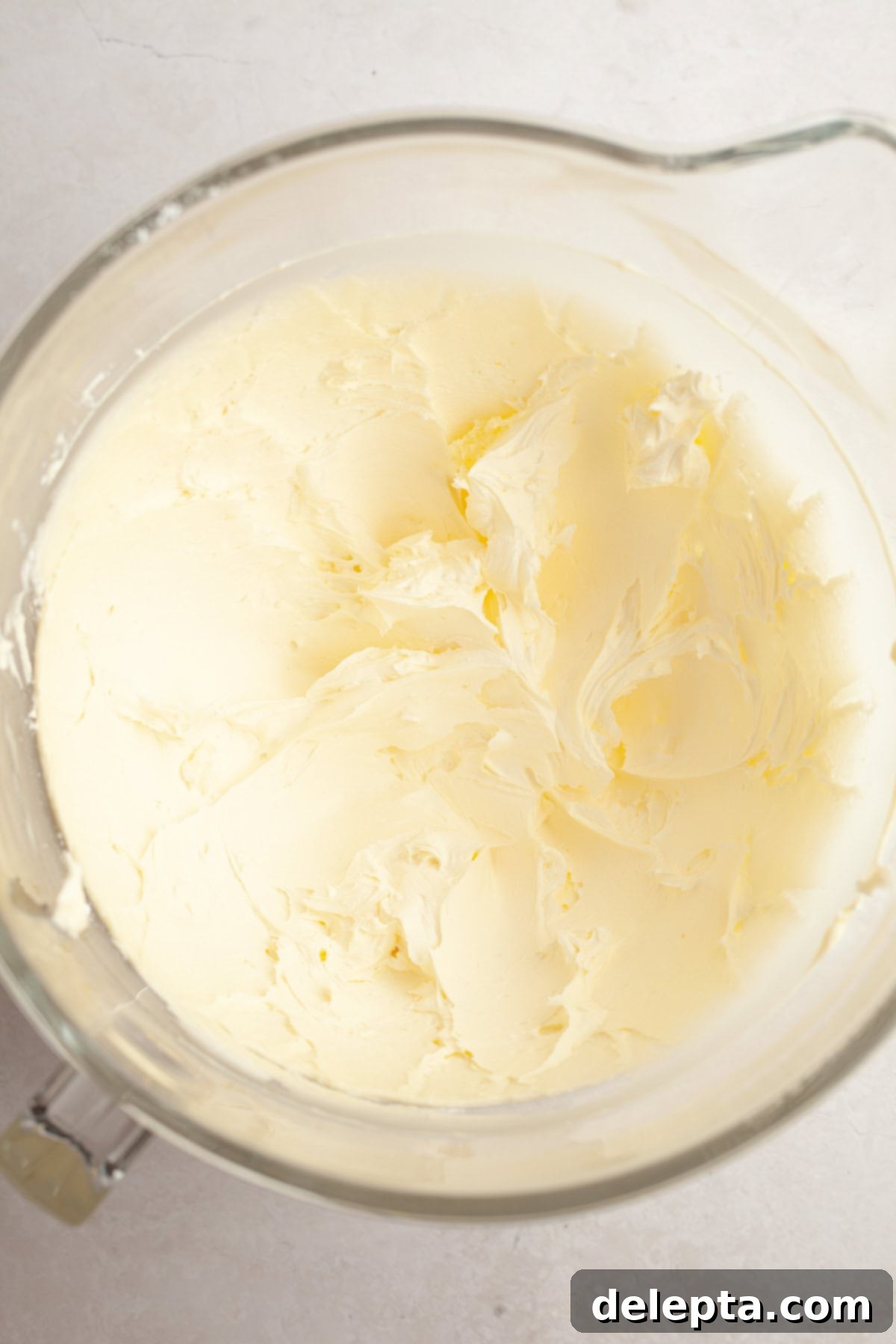 Simple Vanilla Bean Buttercream Perfection 4 Vanilla bean buttercream in a large glass bowl.