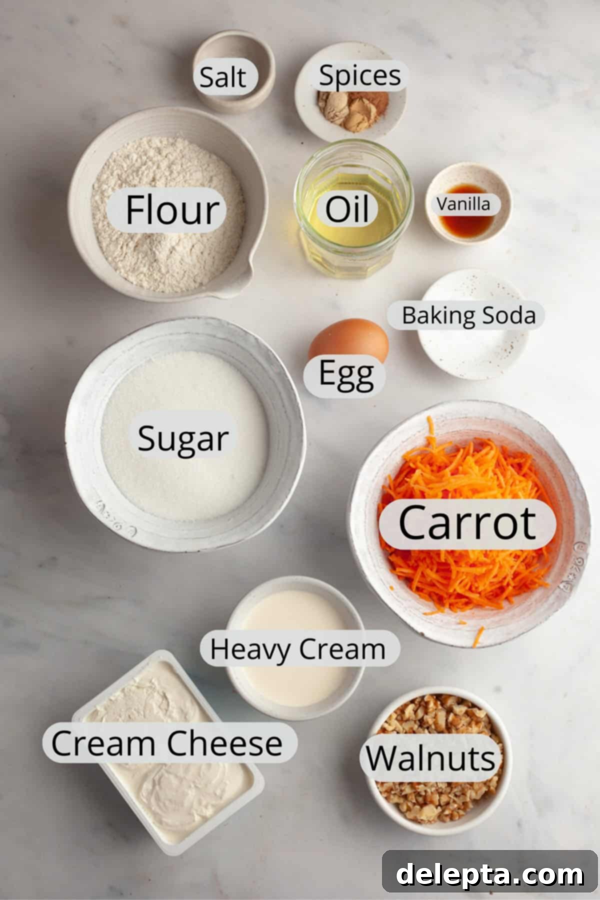 Butter-Free Mini Carrot Cake with Dreamy Cream Cheese Frosting 3 All the ingredients needed to make a mini carrot cake with whipped cream cream cheese frosting weighed out into small bowls.