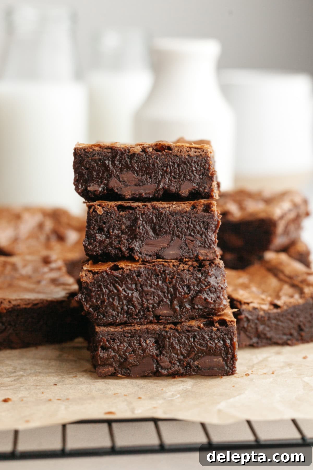 Decadent One Bowl Fudgy Brown Butter Espresso Brownies 2 A stack of four fudgy brown butter espresso brownies, showcasing their rich color and crinkly tops.