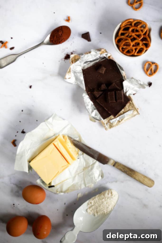 Fireside S'mores Brownies 3 Ingredients for making campfire brownies, including flour, cocoa, butter, chocolate, sugars, eggs, vanilla, espresso powder, and pretzels