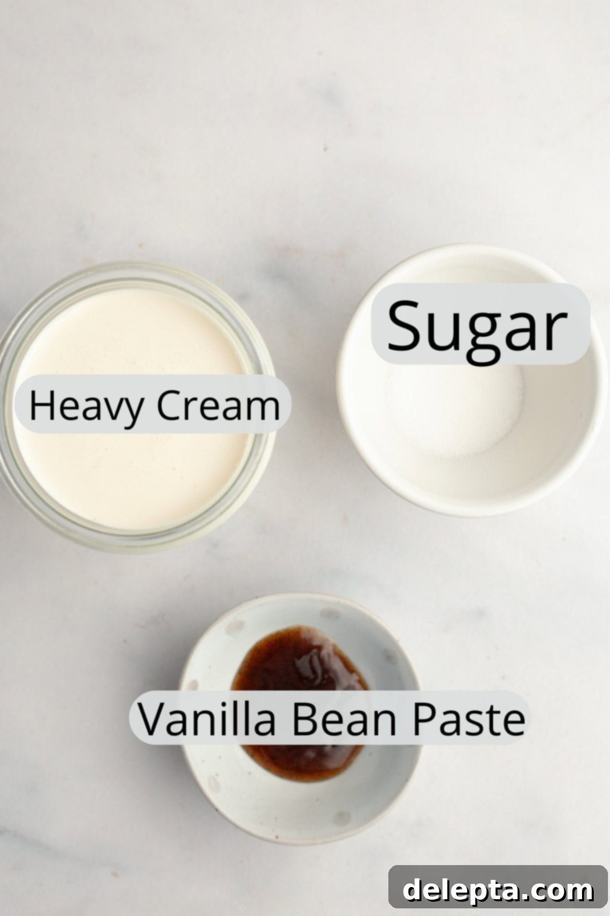 Simple Homemade Vanilla Bean Whipped Cream 3 All the ingredients needed to make vanilla bean whipped cream, weighed out into small bowls for visual clarity.