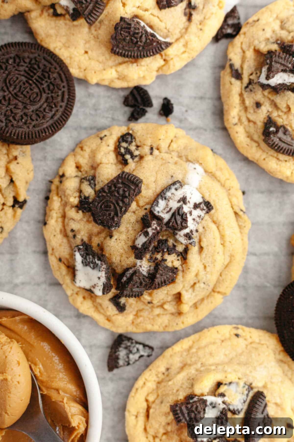 One Bowl Brown Butter Peanut Butter Oreo Perfection 2 A close up of Oreo peanut butter cookies on parchment paper.