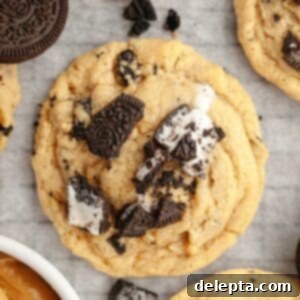 One Bowl Brown Butter Peanut Butter Oreo Perfection 12 A close up of an Oreo peanut butter cookie on parchment paper.