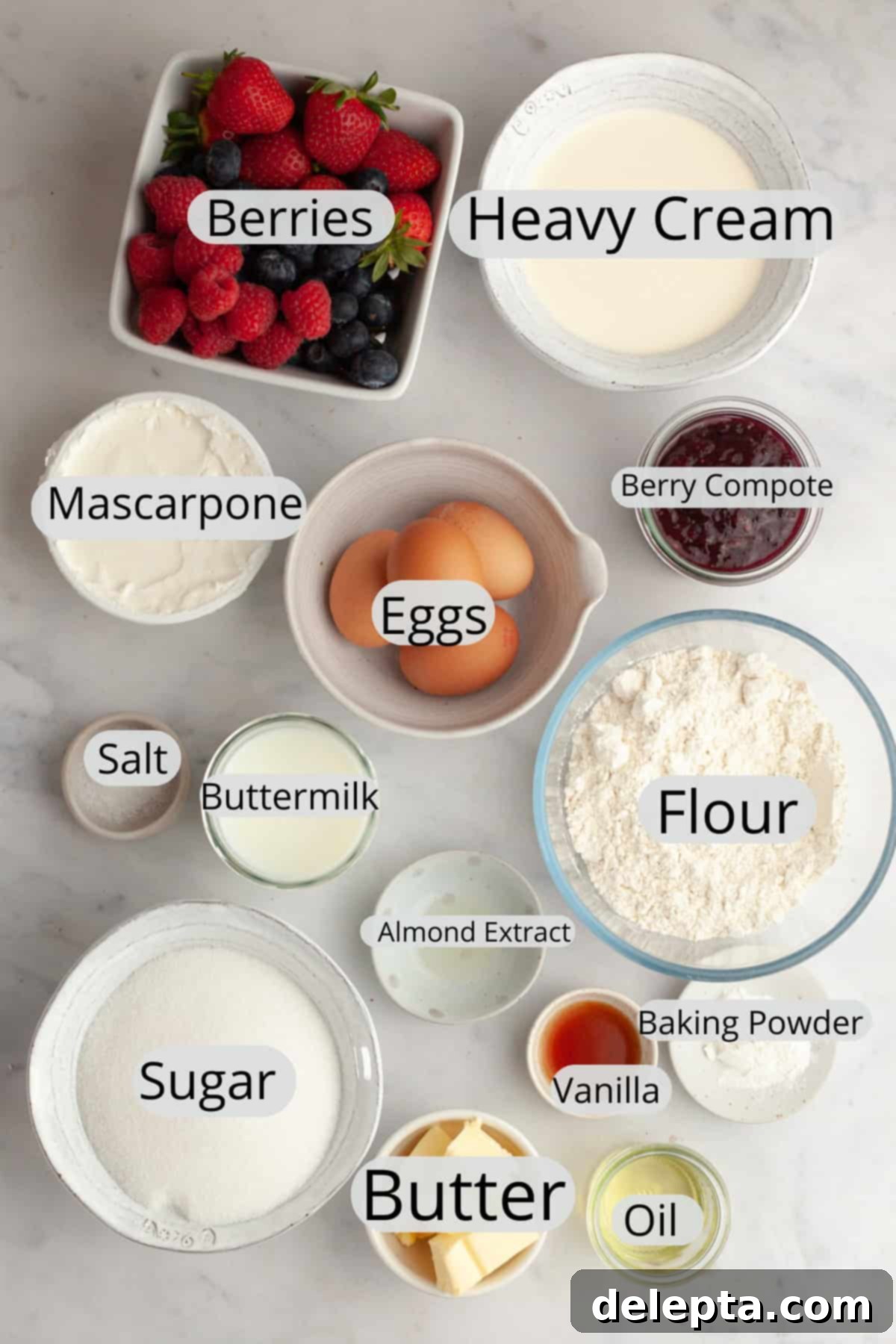 Berry Vanilla Mascarpone Bliss 3 All the essential ingredients meticulously weighed and prepared in small bowls, ready for baking a berry vanilla cake.