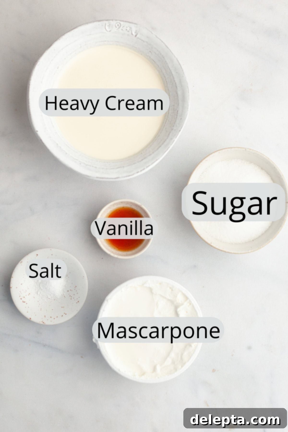 Dreamy 5-Ingredient Mascarpone Whipped Cream Frosting 3 All the ingredients needed to make mascarpone whipped cream frosting, weighed out into small bowls.