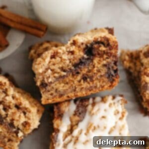 Perfectly Moist Banana Coffee Cake with Tangy Sour Cream 12 A close up of banana coffee cake, drizzled with a white glaze.