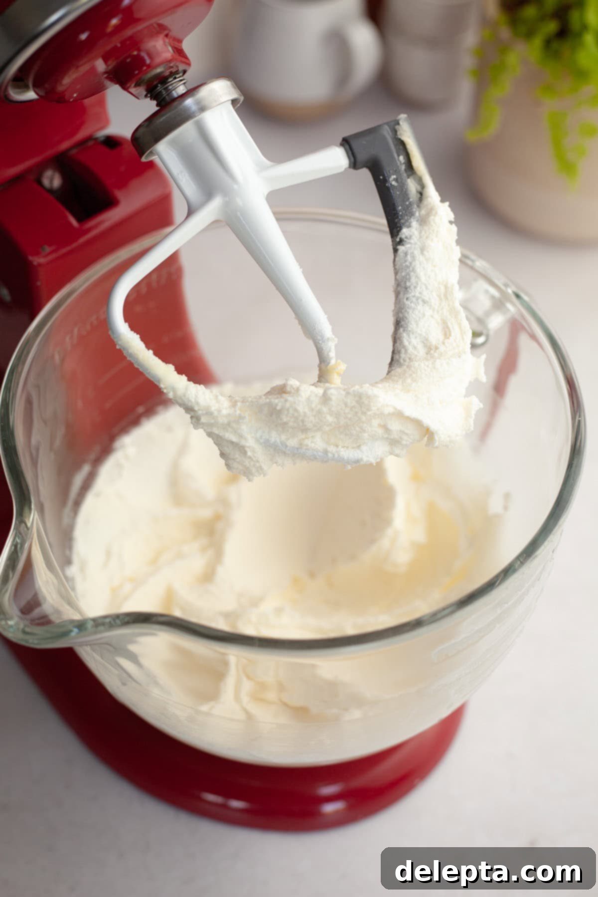 Double Chocolate Chip Sheet Cake 4 Whipped butter and sugar in a red stand mixer.