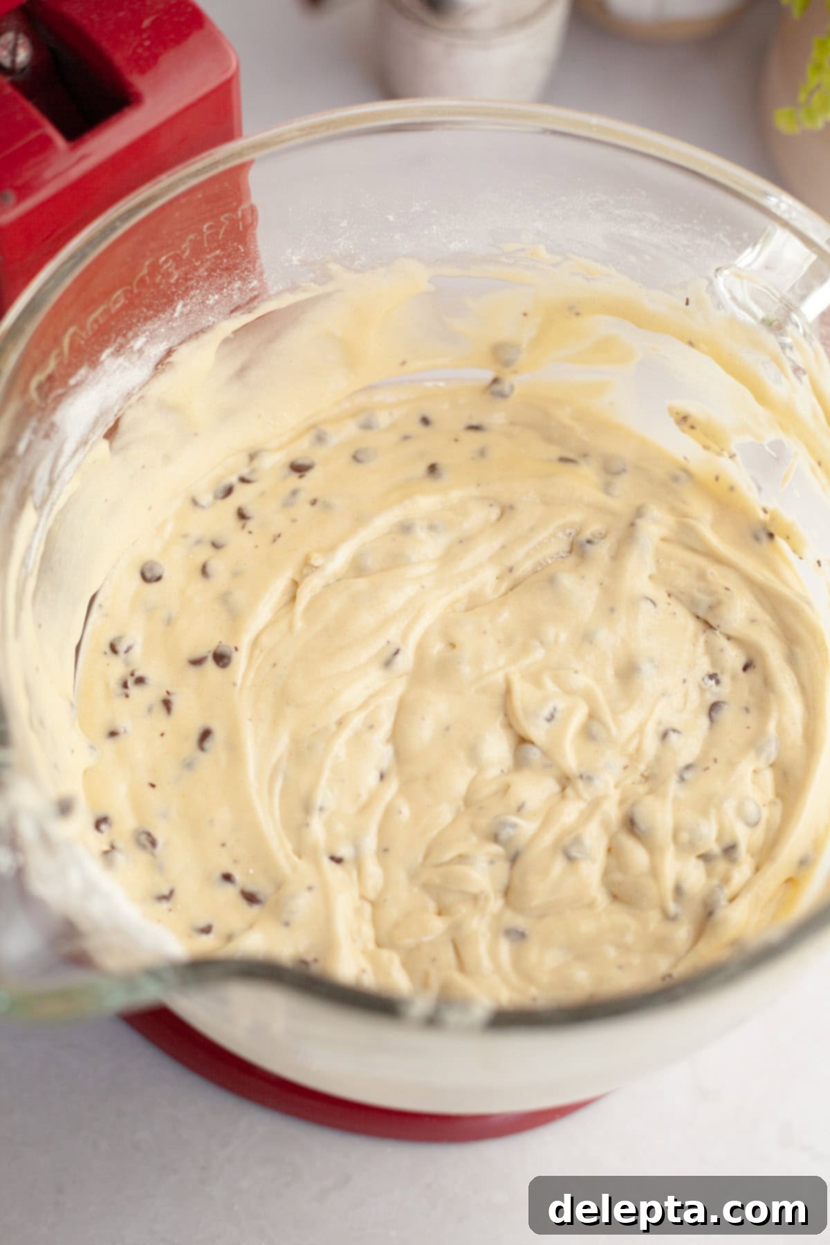 Double Chocolate Chip Sheet Cake 6 Chocolate chip cake batter in a glass mixing bowl.