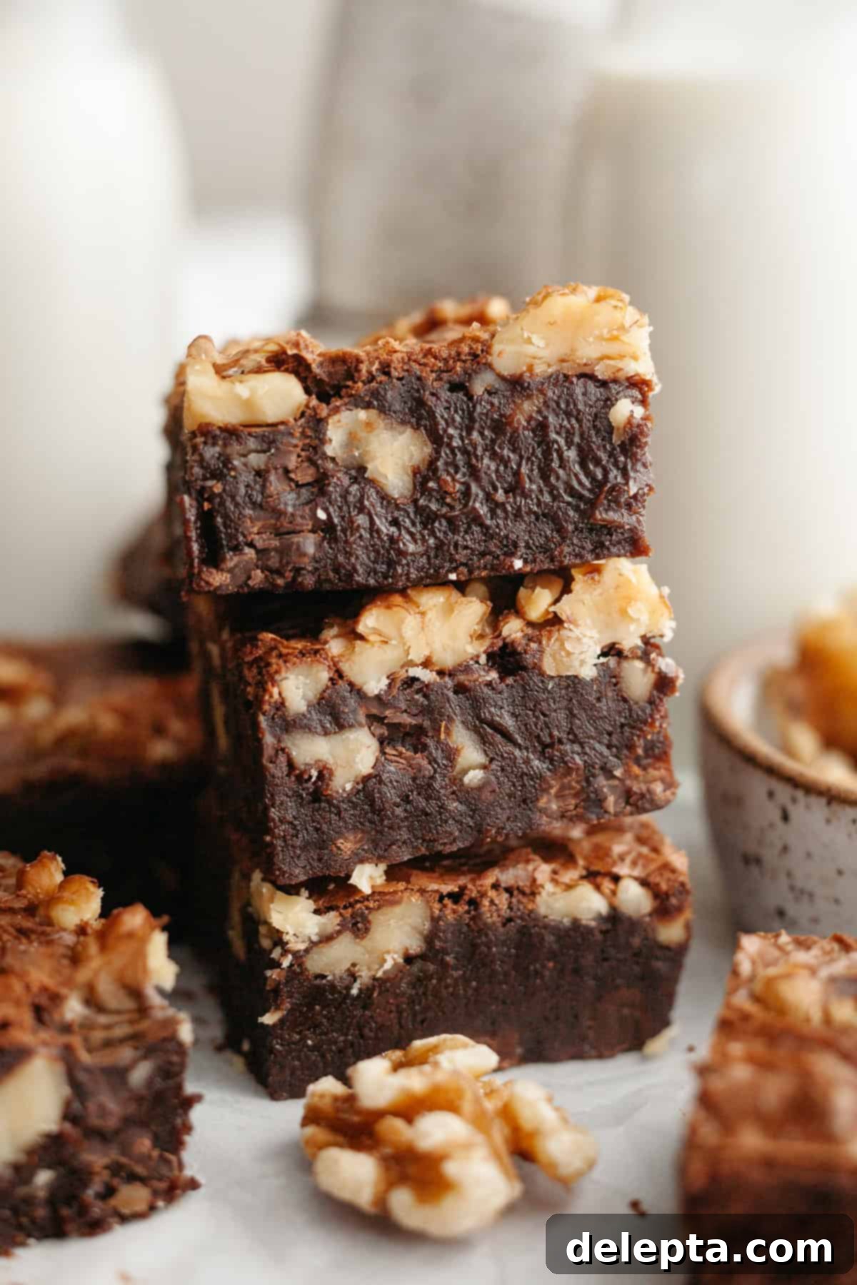 One Bowl Wonder Fudgy Walnut Brownies 2 A stack of three fudgy walnut brownies.