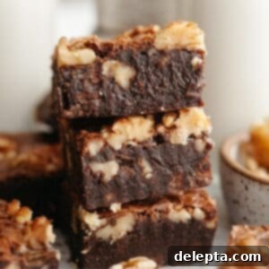 One Bowl Wonder Fudgy Walnut Brownies 10 A stack of three fudgy walnut brownies.