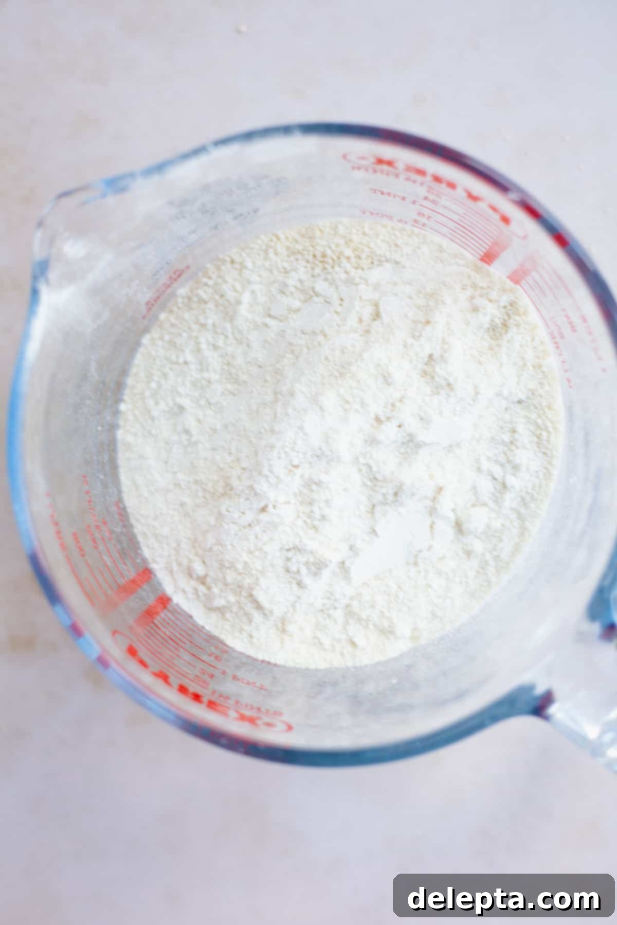 Funfetti Macarons 7 A large pyrex bowl with sifted powdered sugar and almond flour