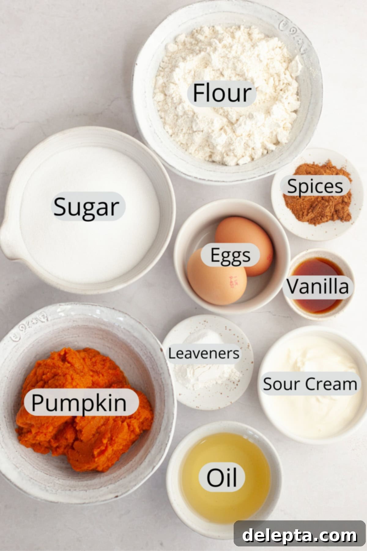 One-Bowl Pumpkin Sour Cream Muffins 3 All the essential ingredients meticulously weighed out into small bowls, ready to be combined for the pumpkin sour cream muffins.