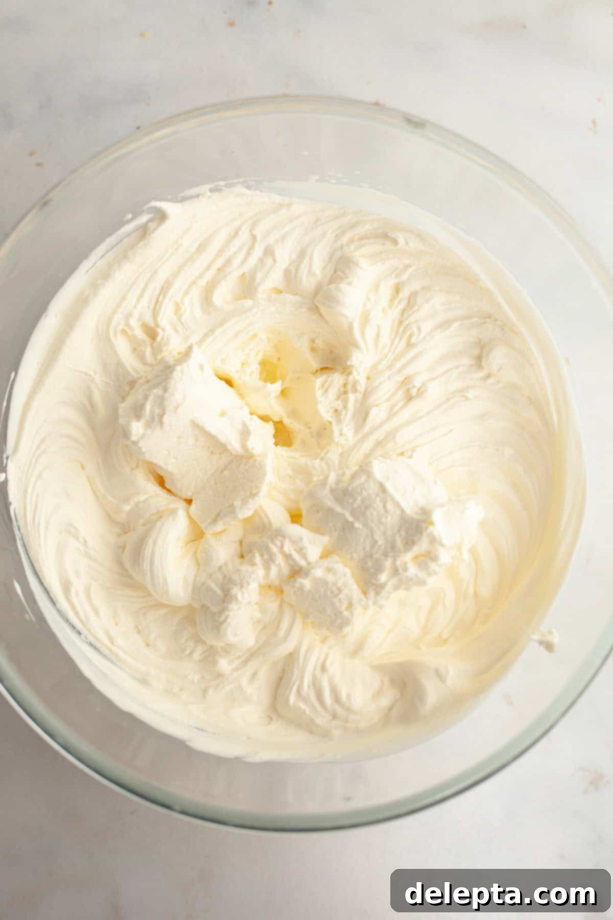 Gelatin-Free No-Bake Vanilla Cheesecake 6 Whipped cream in a glass bowl.