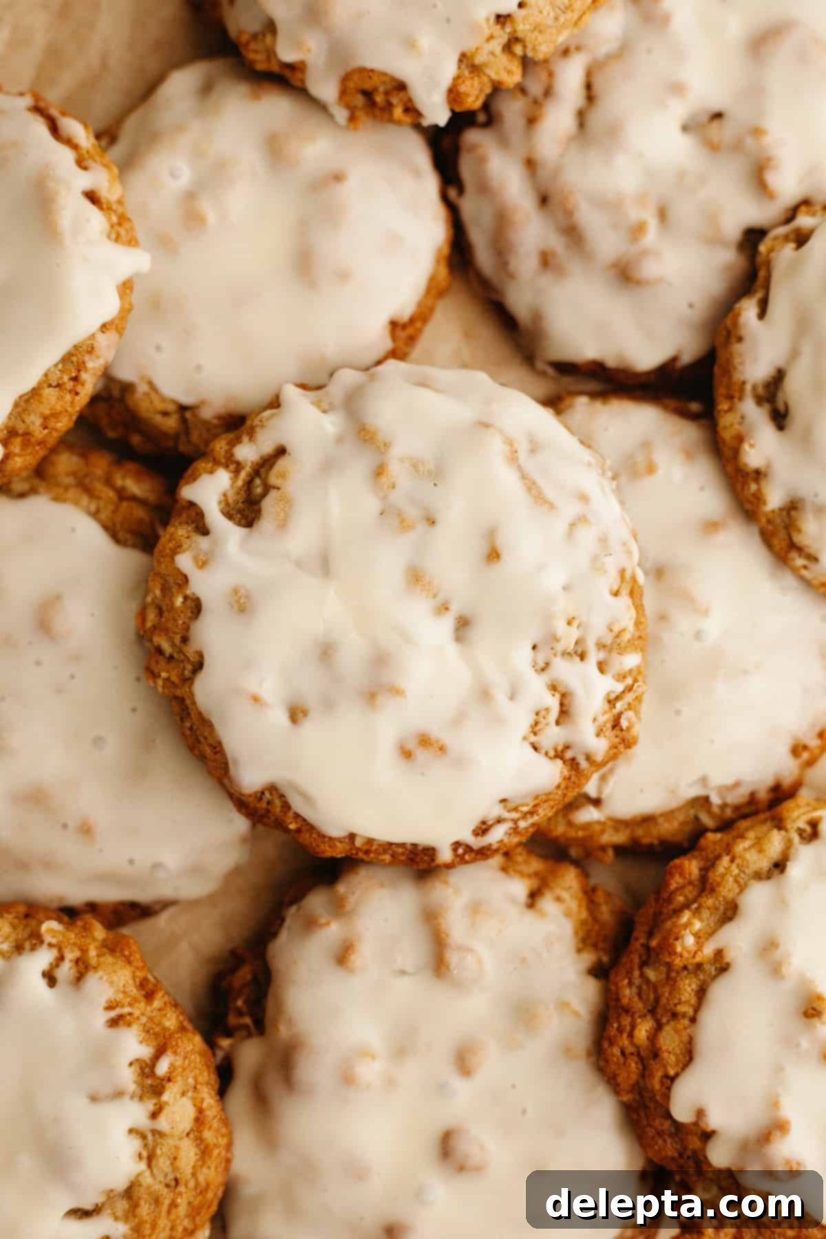 Aromatic Cardamom Oatmeal Cookies with Maple Espresso Glaze 2 A close up of glazed cardamom oatmeal cookies, showing their rich texture and gleaming glaze.