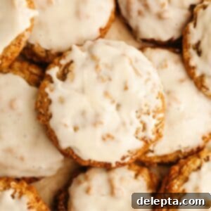 Aromatic Cardamom Oatmeal Cookies with Maple Espresso Glaze 11 A tantalizing close-up of glazed cardamom oatmeal cookies, glistening with maple espresso glaze.