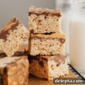 Sweet Chocolate Crispy Delights 9 A small stack of chocolate covered rice krispie treats with butterscotch swirl.