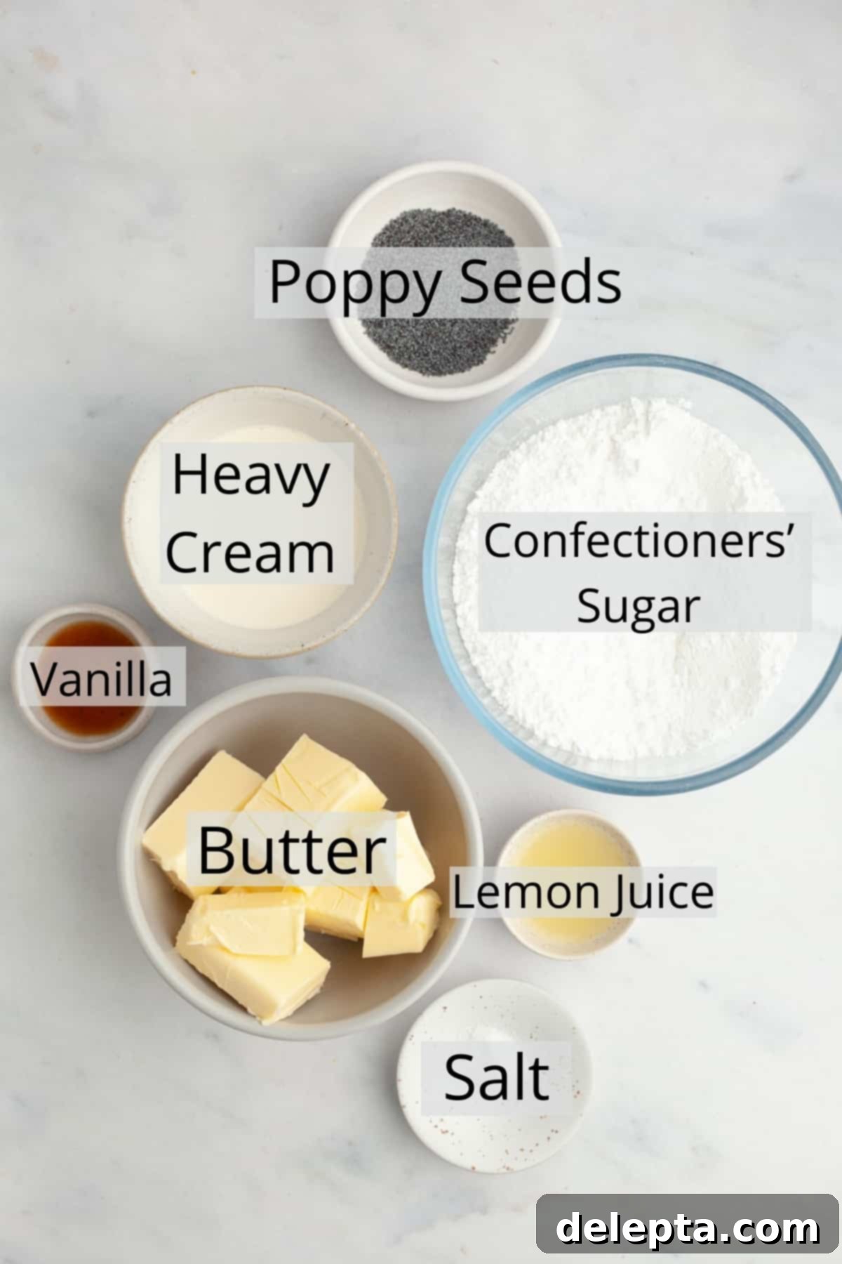 Sunshine Lemon Poppy Seed Cupcakes 4 All the ingredients required for making the lemon poppy seed frosting, pre-measured in small bowls.