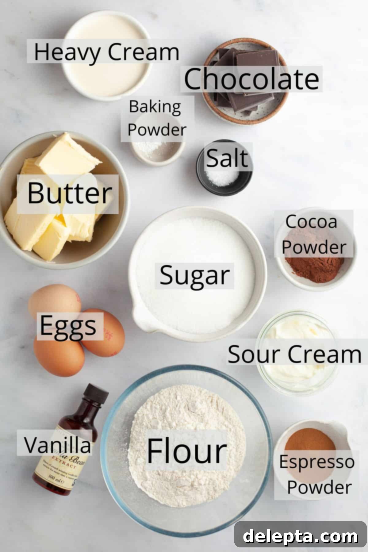 Elegant Swirl Loaf 3 All the ingredients needed to make marble loaf cake weighed out into small bowls, neatly arranged on a kitchen counter.