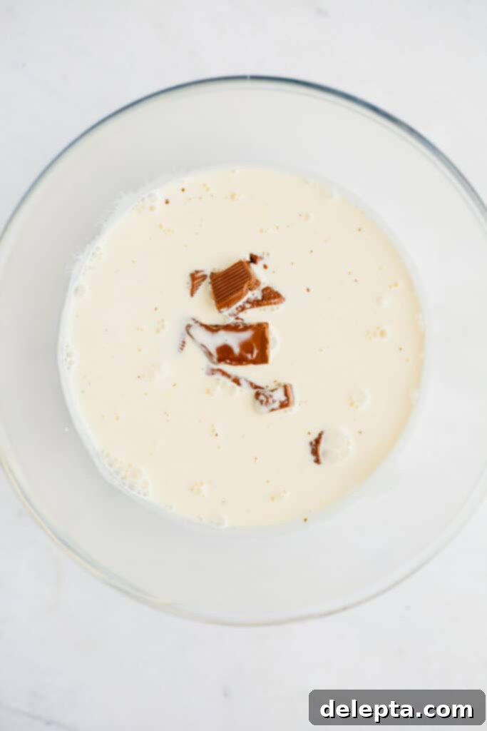 Chocolate-Stuffed Brioche Bliss 16 A pyrex bowl with heavy cream and chopped chocolate