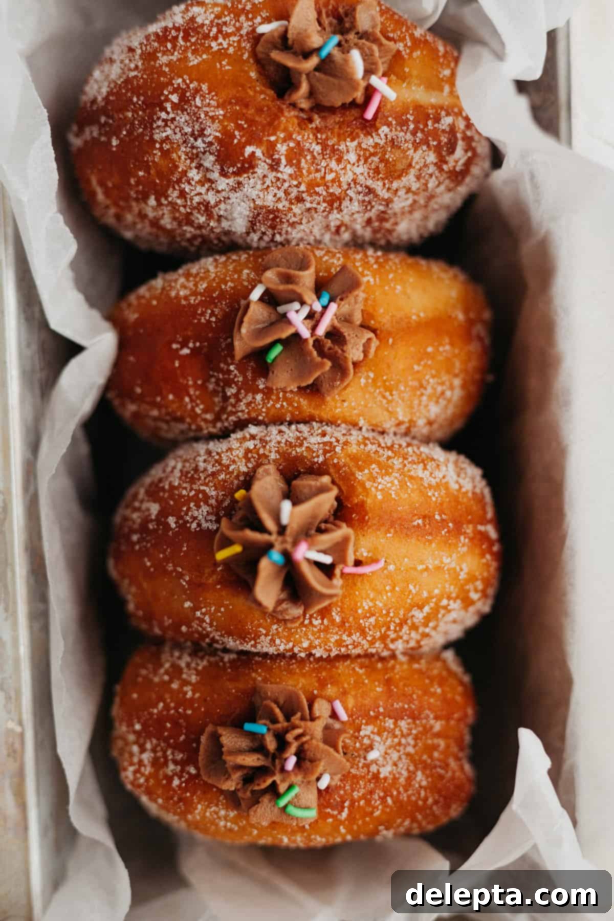 Chocolate-Stuffed Brioche Bliss 19 Four brioche doughnuts filled with chocolate filling in a loaf pan