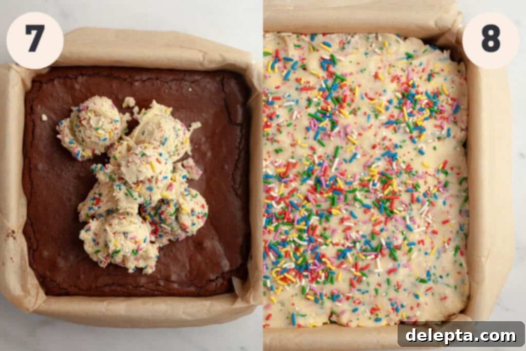 Funfetti Dream Brownies 7 A square pan with baked brownies and scoops of rainbow sprinkle cookie dough on top and then spread over the brownies.