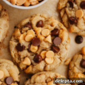 Golden Butterscotch Chocolate Chip Delights 8 Irresistibly chewy chocolate chip butterscotch cookies resting on parchment paper.
