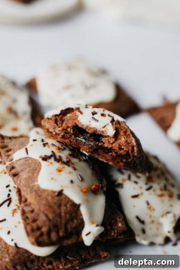 S'mores Pop Tarts with Gooey Marshmallow Glaze 5 s'mores pop tart with a bite taken out