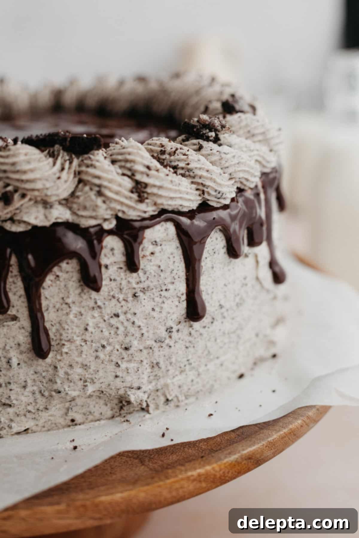 Decadent Oreo Drip Cake 17 A close up of an Oreo drip cake, showing the detail of the ganache and frosting