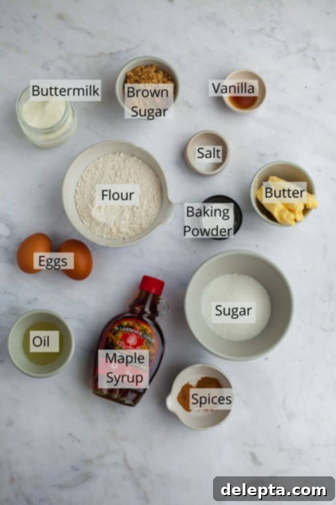 Golden Maple Delights 3 ingredients needed for maple cupcakes in a variety of small bowls, including flour, sugar, butter, and maple syrup
