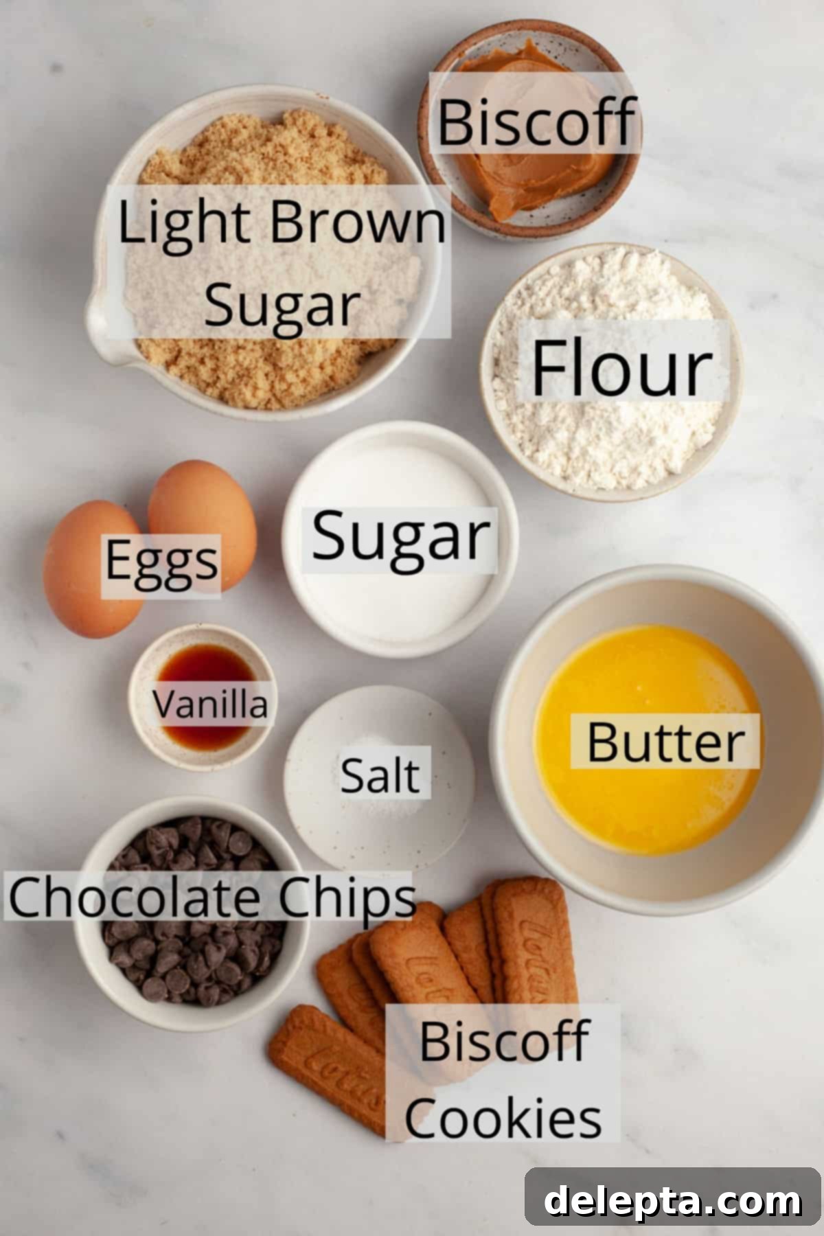 Easy One Bowl Brown Butter Biscoff Blondies 3 All the dry and wet ingredients neatly arranged in small white bowls on a light surface, ready to be combined for the Biscoff blondies.