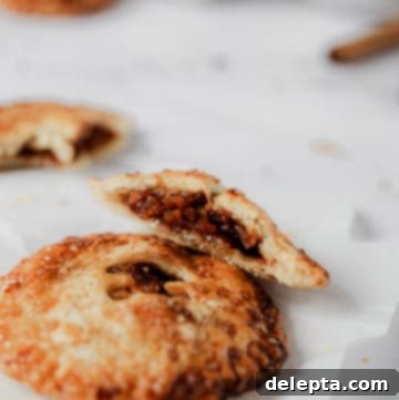 Honey-Kissed Apple Hand Pies 6 A delicious apple and honey hand pie, cut open to show the sweet filling