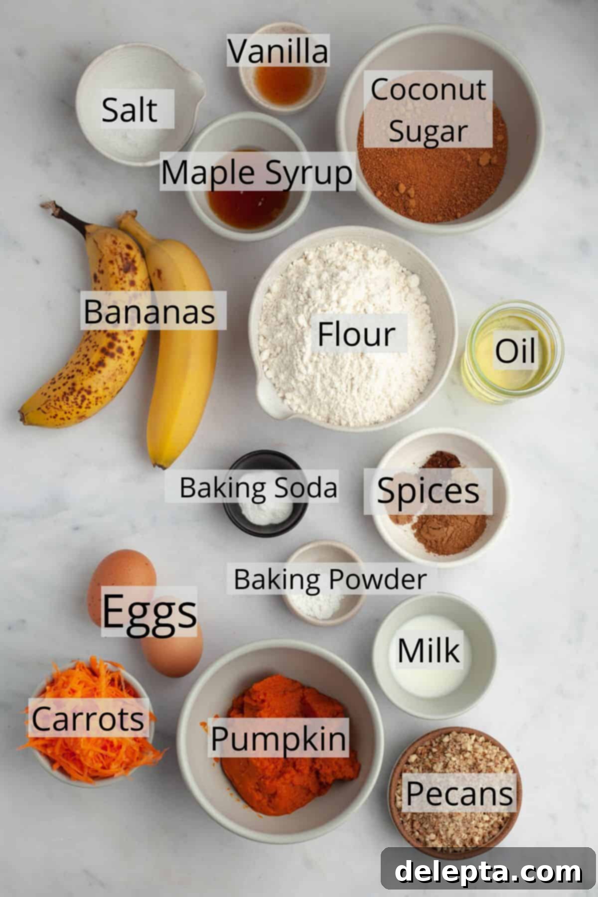 Effortless Pumpkin Carrot Banana Bread 3 All the ingredients needed for healthy pumpkin banana bread carefully weighed out into small bowls, ready for baking.