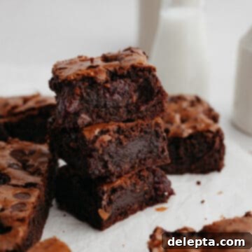 Decadent Triple Chocolate Cherry Brownies 8 A stack of cherry brownies.