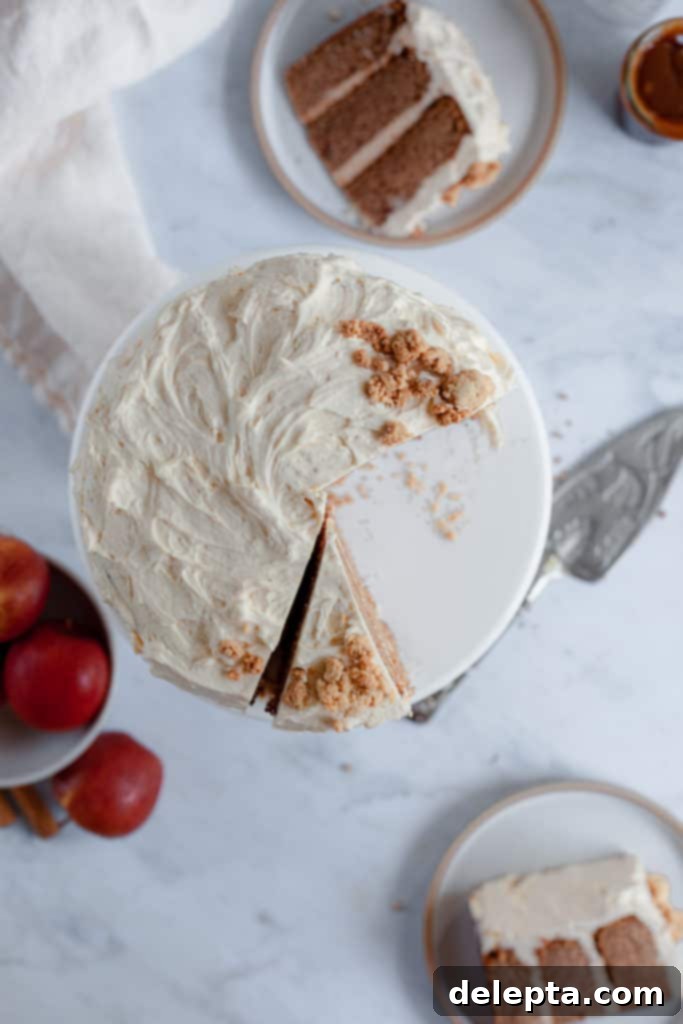 Salted Caramel Apple Cider Layer Cake with Pie Crumb Frosting 6 An overhead view of the apple cider cake, beautifully sliced and arranged on plates, highlighting the various layers and toppings.