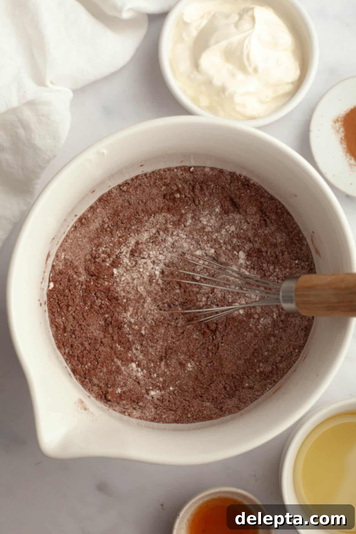 Quick Nutella-Stuffed Cupcakes 4 Flour and cocoa powder in a small bowl.
