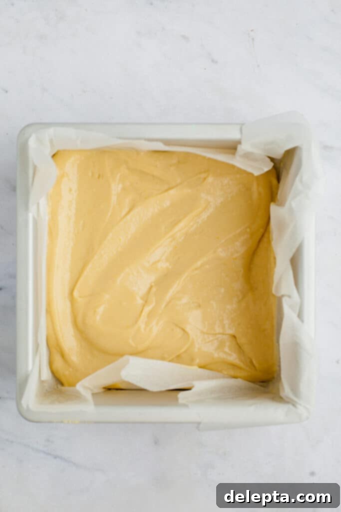 Espresso-Spiked Chai Coffee Cake 12 a square baking pan with coffee cake batter in it