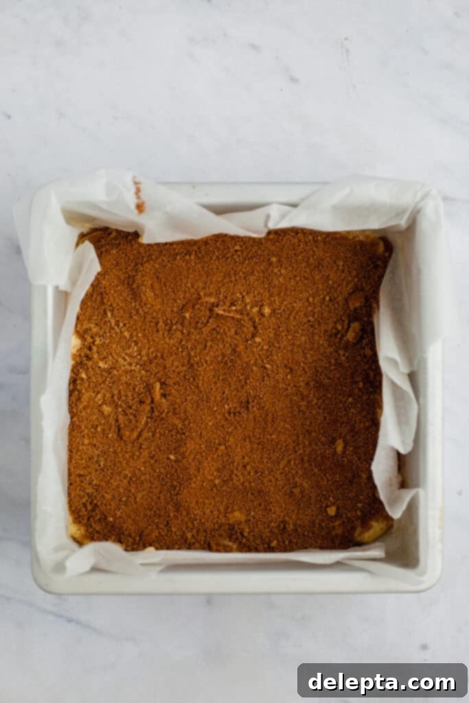 Espresso-Spiked Chai Coffee Cake 13 A square baking pan with coffee cake batter and streusel