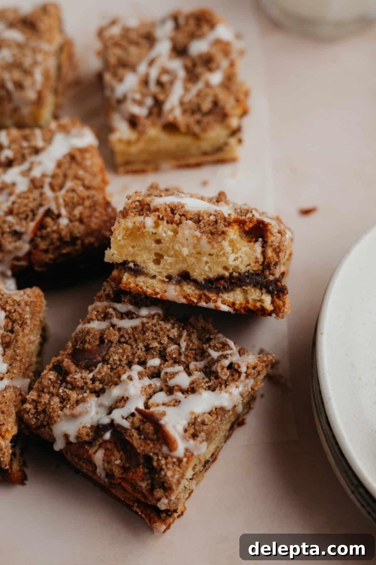 Espresso-Spiked Chai Coffee Cake 16 Several square slices of coffee cake. One has been angled to show you the inside of the cake