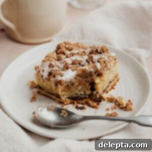 Espresso-Spiked Chai Coffee Cake 17 a square slice of chai coffee cake on a small beige plate