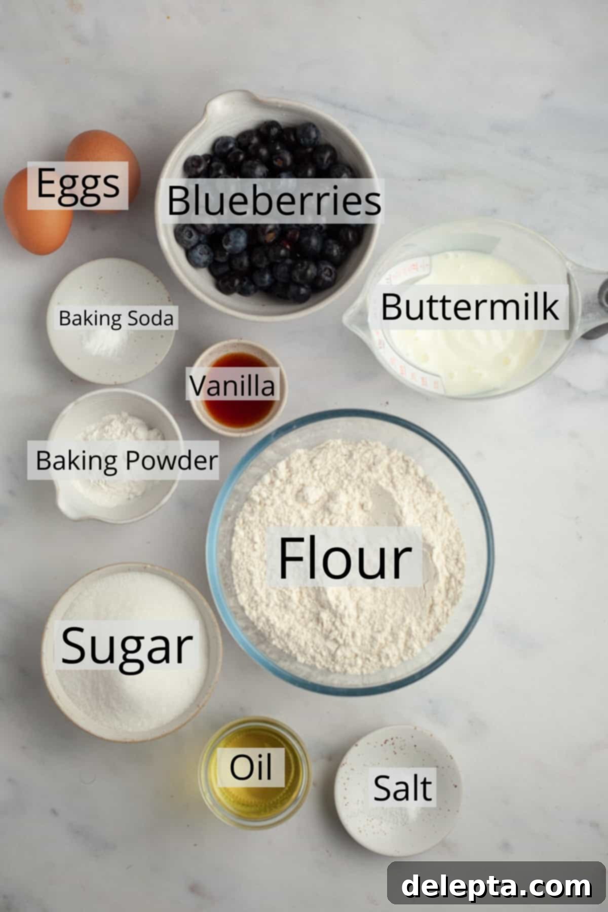 Signature Buttermilk Blueberry Muffins 3 All the ingredients needed to make blueberry muffins, precisely weighed out into small bowls, ready for mixing.