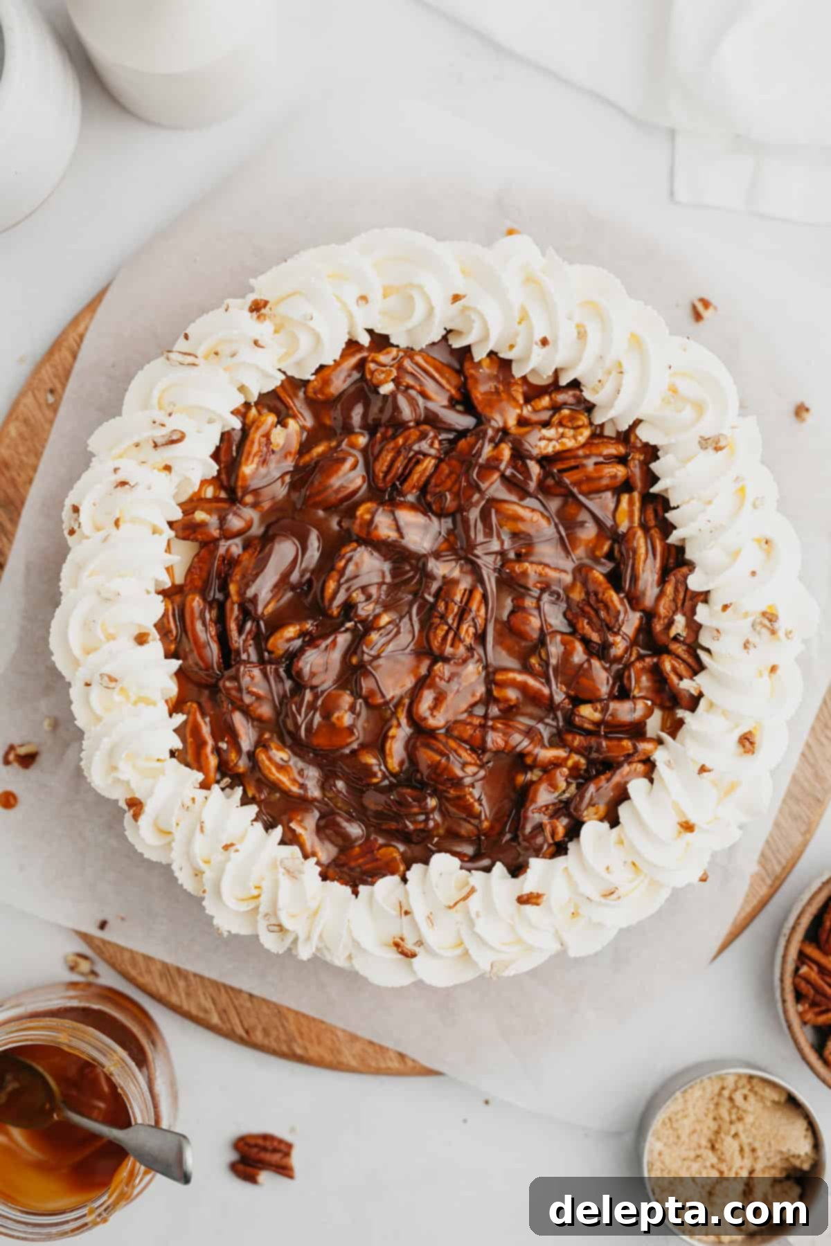 Irresistible No-Bake Turtle Dream 7 An overhead shot of a finished turtle pie, beautifully adorned with caramel pecans and a decorative border of whipped cream, ready to be served.